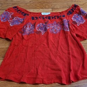 Off the shoulder red shirt